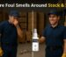 Warehouse worker reacting to foul smell caused by dead rodent, highlighting need for odor remover in storage areas
